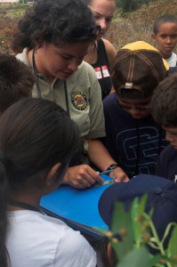 A volunteer docent sharing information with a group at the Tijuana Estuary