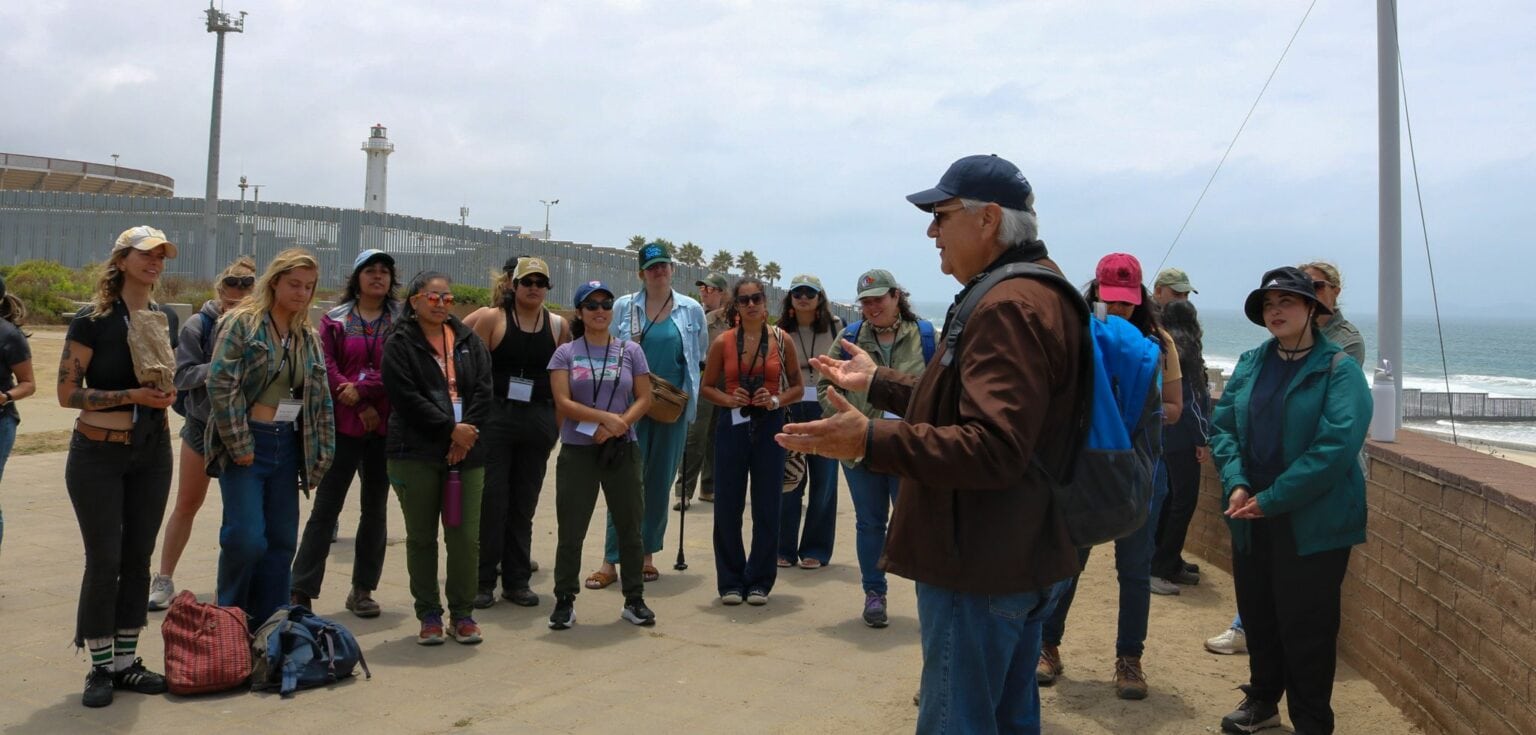 Group of teachers listening to a guide at Tijuana Estuary.