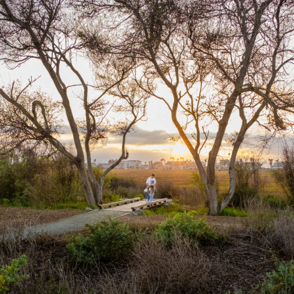 A mother and child overlooking the wetlands at the Tijuana River National Estuarine Research Reserve